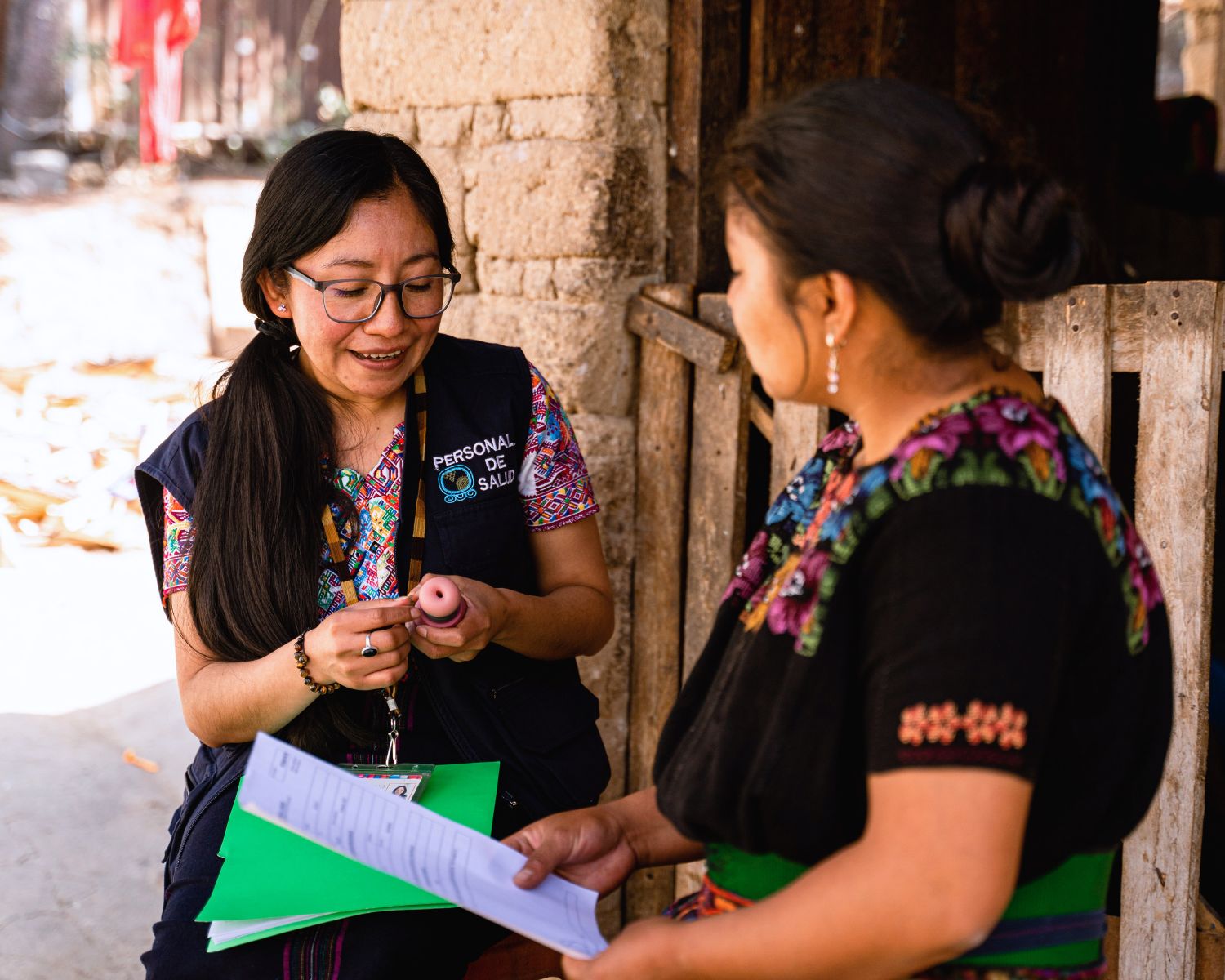 Women's Health program manager with a patient